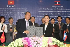 Lễ ký biên bản bàn giao công trình. (Nguồn: TTXVN)