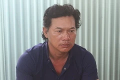 Đối tượng Nguyễn Văn Xuân tại cơ quan công an. (Ảnh: Nguyễn Văn Việt/TTXVN)