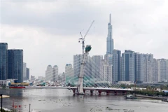 Dự án cầu Thủ Thiêm 2, nối Quận 1 và thành phố Thủ Đức, đã thi công đạt khoảng 70% khối lượng. (Ảnh: Tiến Lực/TTXVN)