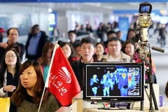 Hành khách Trung Quốc tại sân bay quốc tế Incheon, phía tây thủ đô Seoul, Hàn Quốc. (Nguồn: YONHAP/TTXVN)