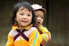 Mùa xuân rạng ngời trên gương mặt trẻ. (Ảnh: Phương Hoa/TTXVN)