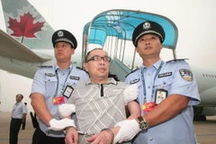 Một tội phạm Trung Quốc bị dẫn độ. (Nguồn: Reuters)