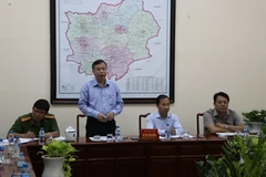 Phó Chủ tịch UBND tỉnh Bình Phước Huỳnh Anh Minh phát biểu tại buổi đối thoại. (Ảnh: Dương Chí Tưởng/TTXVN)