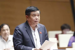 Bộ trưởng Bộ Kế hoạch và Đầu tư Nguyễn Chí Dũng phát biểu giải trình, làm rõ một số vấn đề đại biểu Quốc hội nêu. (Ảnh: Doãn Tấn/TTXVN)