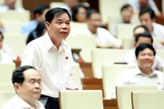 Bộ trưởng Bộ Nông nghiệp và Phát triển Nông thôn Nguyễn Xuân Cường giải trình, làm rõ một số vấn đề đại biểu Quốc hội nêu. (Ảnh: Trọng Đức/TTXVN)