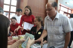 Người dân có đất bị thu hồi được nhận số tiền đền bù, hỗ trợ rất lớn. (Ảnh: Công Phong/TTXVN)