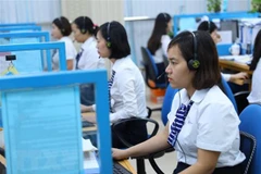 Các Trung tâm Chăm sóc khách hàng- nơi tiếp nhận thông tin và hướng dẫn khách hàng sử dụng các dịch vụ trực tuyến của ngành điện. (Ảnh: Ngọc Hà/TTXVN)