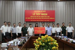 Quang cảnh buổi lễ tiếp nhận. (Ảnh: Nguyễn Thắng/TTXVN)