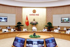 Thủ tướng Nguyễn Xuân Phúc phát biểu tại phiên họp giữa Thường trực Chính phủ với Ban Chỉ đạo phòng, chống COVID 19. (Ảnh: Thống Nhất/TTXVN)