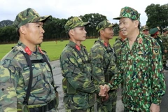 Chủ tịch nước Trần Đại Quang làm việc với Bộ Quốc phòng tại Trung tâm Huấn luyện Miếu Môn, Hà Nội. (Ảnh: Nhan Sáng/TTXVN)