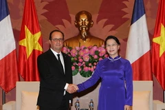 Chủ tịch Quốc hội Nguyễn Thị Kim Ngân hội kiến Tổng thống Pháp Francois Hollande. (Ảnh: Trọng Đức/TTXVN)