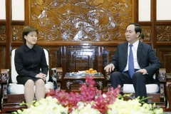Chủ tịch nước Trần Đại Quang tiếp bà Catherine Wong Siow Ping, Đại sứ Singapore tại Việt Nam. (Ảnh: Nhan Sáng/TTXVN)