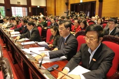 Quốc hội biểu quyết thông qua dự thảo Luật Đất đai