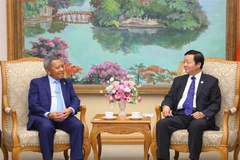 Phó Thủ tướng Trần Hồng Hà tiếp Bộ trưởng Bộ Công nghệ và Truyền thông Lào Boviengkham Vongdara. (Ảnh: Văn Điệp/TTXVN)