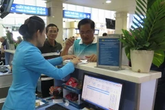 Sân bay Tân Sơn Nhất hoạt động ổn định trở lại sau sự cố tin tặc. (Ảnh: Hoàng Hải/TTXVN)