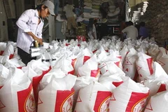 Đóng bao gạo xuất khẩu tại Công ty lương thực Thành phố Hồ Chí Minh. (Ảnh minh họa. Đình Huệ/TTXVN) 