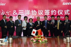 Quang cảnh lễ ký kết chiều ngày 18/10. (Ảnh: M.C/Vietnam+)