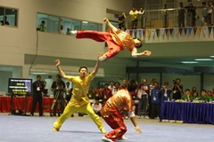 Ba vận động viên Nguyễn Huy Thanh, Trần Đức Trọng và Trần Xuân Hiệp đã xuất sắc giành huy chương vàng. (Ảnh: Hoàng Hà/TTXVN)