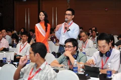 Khách tham dự buổi họp báo về Diễn đàn Mobile Marketing Toàn cầu 2013. (Nguồn: Vietnam+)