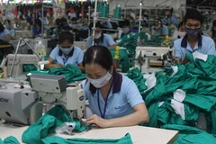 Dệt may là mặt hàng xuất khẩu chủ lực của Việt Nam sang Mỹ. (Ảnh minh họa: Thanh Vũ/TTXVN)