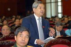 Bộ trưởng Bộ Tài nguyên và Môi trường Phạm Khôi Nguyên phát biểu ý kiến. (Ảnh: Doãn Tấn/TTXVN).