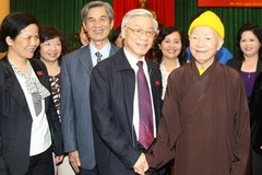 Tổng Bí thư dự Hội nghị tiếp xúc cử tri và báo cáo kết quả Kỳ họp thứ 9, Quốc hội khóa XII. (Ảnh: Trí Dũng/TTXVN)