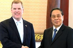 Chủ tịch nước Lào Chummaly Saynhasone tiếp Bộ trưởng Ngoại giao Canada. (Ảnh: Hoàng Chương/Vietnam+)