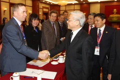 Tổng Bí thư Nguyễn Phú Trọng với các đại biểu tại buổi tiếp. (Ảnh: Trí Dũng/TTXVN)