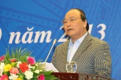 Phó Thủ tướng Nguyễn Xuân Phúc phát biểu tại hội nghị. (Ảnh: Doãn Tấn/TTXVN)