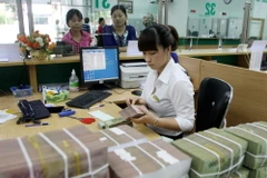 Phấn đấu đến cuối năm 2015 đưa tỷ lệ nợ xấu dưới 3%