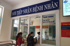 Người dân đăng ký khám chữa bệnh bảo hiểm y tế. (Ảnh: T.G/Vietnam+)