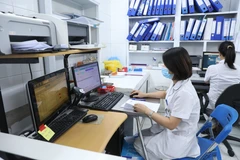 Các bệnh viện đẩy mạnh các ứng dụng hiện đại như nhận diện khuân mặt trong khám chữa bệnh. (Ảnh: PV/Vietnam+)