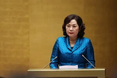 Thống đốc Ngân hàng Nhà nước Việt Nam Nguyễn Thị Hồng trình bày Báo cáo tổng kết. (Ảnh: Dương Giang/TTXVN)