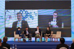 Các chuyên gia chia sẻ tại diễn đàn. (Ảnh: PV/Vietnam+)