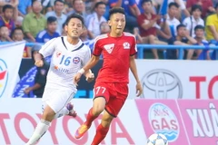 Nghiêm Xuân Tú (áo đỏ) đang có những bước tiến dài trong sự nghiệp. (Ảnh: Minh Chiến/Vietnam+)