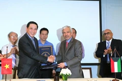 Quang cảnh lễ ký kết. (Ảnh: Mỹ Phương/Vietnam+)