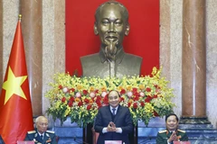 Chủ tịch nước Nguyễn Xuân Phúc tại buổi gặp mặt Ban Liên lạc Cựu chiến binh Sư đoàn Phòng không 361. (Ảnh: Thống Nhất/TTXVN)