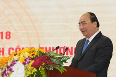 Thủ tướng Nguyễn Xuân Phúc phát biểu chỉ đạo tại hội nghị ngành công thương. (Ảnh: Đức Duy/Vietnam+)