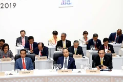 Thủ tướng Nguyễn Xuân Phúc dự Phiên thứ nhất về Kinh tế toàn cầu, Thương mại và Đầu tư. (Ảnh: Thống Nhất/TTXVN)