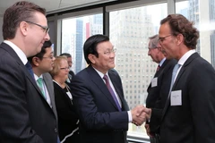 Chủ tịch nước Trương Tấn Sang gặp gỡ đại diện doanh nghiệp Hoa Kỳ dự đối thoại. (Ảnh: Nguyễn Khang/TTXVN)