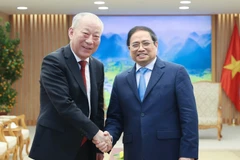 Thủ tướng Phạm Minh Chính tiếp ông Nghiêm Giới Hòa, Người sáng lập Tập đoàn xây dựng Thái Bình Dương (Trung Quốc). (Ảnh: Dương Giang/TTXVN)