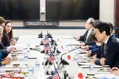 Bộ trưởng Công nghiệp Nhật Bản Yasutoshi Nishimura và Bộ trưởng Năng lượng Mỹ Jennifer Granholm tại cuộc họp ngày 9/1. (Nguồn: Kyodo)