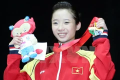 Dương Thúy Vi là người mở hàng vàng cho đội tuyển wushu Việt Nam ở SEA Games 28. (Ảnh: Quốc Khánh/TTXVN)
