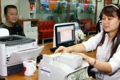 Tỷ giá bình quân liên ngân hàng bất ngờ được điều chỉnh thêm 1%