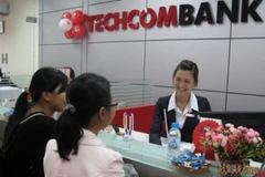 Giao dịch vàng tại Techcombank. (Ảnh: Trần Việt/TTXVN)