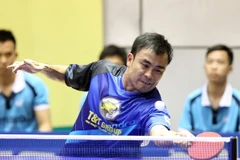 Tay vợt Trần Tuấn Quỳnh (Hà Nội T&T) thi đấu vòng loại nội dung đồng đội nam. (Ảnh: Quốc Khánh/TTXVN)