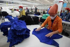 Sản xuất hàng xuất khẩu tại Công ty TNHH may Tinh Lợi, Khu Công nghiệp Nam Sách (Hải Dương). (Ảnh: Trần Việt/TTXVN)