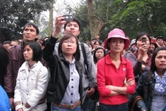 Háo hức đợi đến giờ thiêng (Ảnh: PV/Vietnam+)
