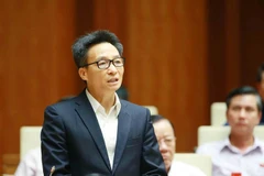 Phó Thủ tướng Vũ Đức Đam trả lời chất vấn những vấn đề đại biểu Quốc hội nêu. (Ảnh: Phương Hoa/TTXVN)