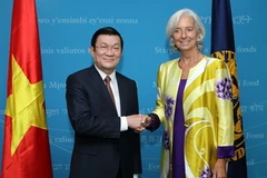 Chủ tịch nước Trương Tấn Sang gặp Giám đốc điều hành Quỹ Tiền tệ Quốc tế (IMF), bà Christine Largade. (Ảnh: Nguyễn Khang/TTXVN)